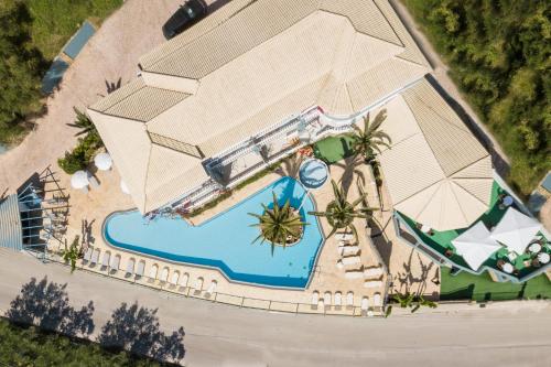 an overhead view of a resort with a pool and an umbrella at Zante Calinica Hotel in Tsilivi