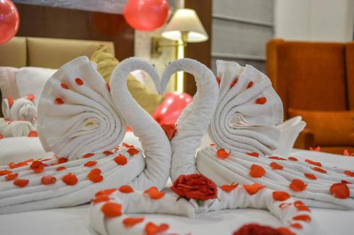 two swans made out of white icing on a cake at Regenta Central Srinagar, Rajbagh in Srinagar