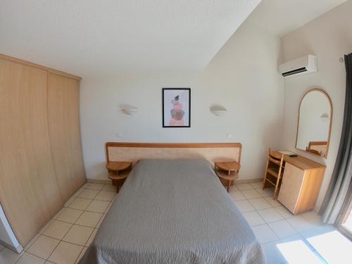 Ένα ή περισσότερα κρεβάτια σε δωμάτιο στο Hotel et Résidence Cala di sole