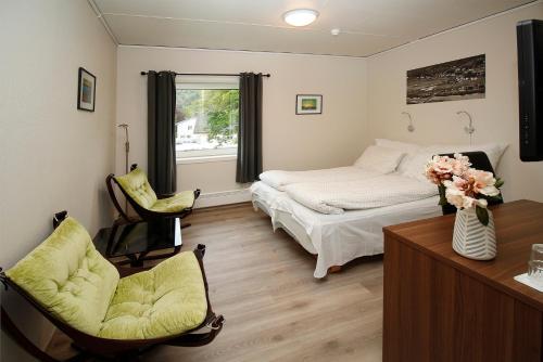 Postel nebo postele na pokoji v ubytování Sentrum Hotel