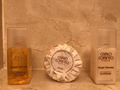 a group of three bottles of soap on a counter at Grand Isla Navidad Golf & Spa Resort with Marina in Barra de Navidad