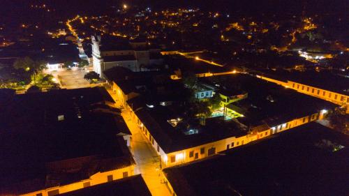 an overhead view of a building at night with lights at Casa Hotel Guaracú in Santa Fe de Antioquia