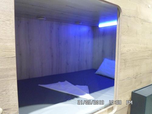 
A bed or beds in a room at Capsule Hotel Pulkovo
