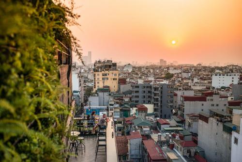 a view of a city skyline at sunset at La Siesta Premium Hang Be in Hanoi