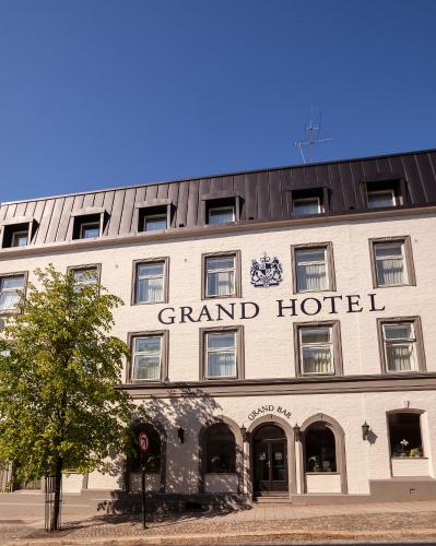 a large building with the grand hotel on it at Grand Hotel Arendal - Unike Hoteller in Arendal