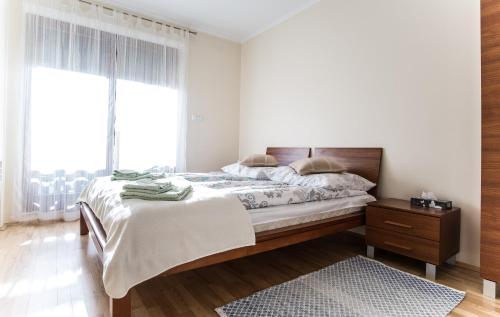 Кровать или кровати в номере Apartament Pardałówka Zakopane
