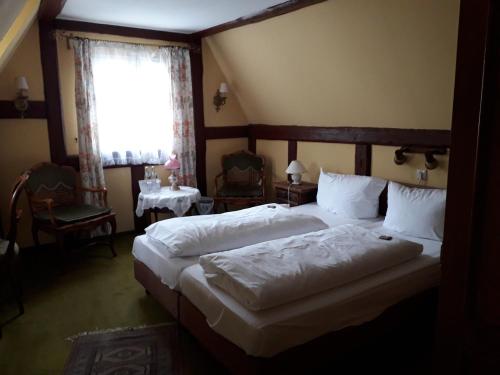 Postel nebo postele na pokoji v ubytování Hotel Feiler