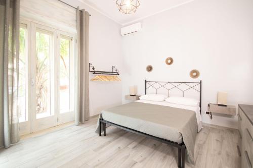 Postel nebo postele na pokoji v ubytování Rudiae Boutique