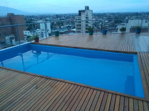 a swimming pool on the roof of a building at Bello Departamento 2 Habitaciones, Barrio Norte in San Miguel de Tucumán