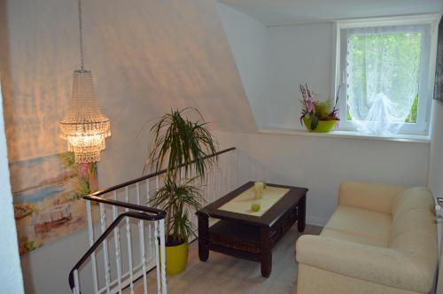 a living room with a couch and a table at Ambiente in Soltau