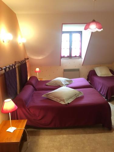 Ліжко або ліжка в номері Chambres d’hôtes « Les sorbiers »