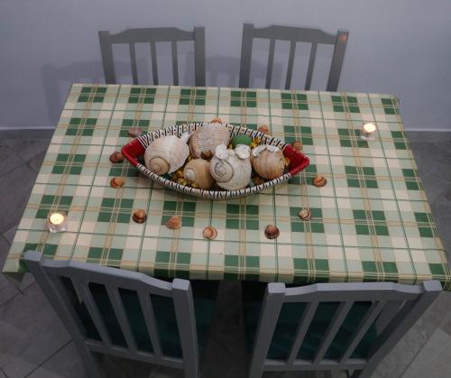 a table with a plate of mushrooms on it at Doci Seven Hotel in Velipojë