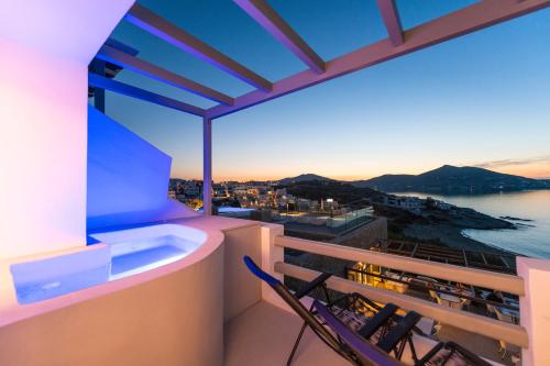 a balcony with a view of the water at Hotel Senia - Onar Hotels Collection in Naousa