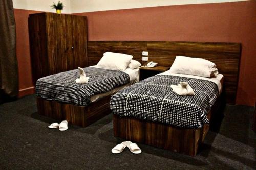 Llit o llits en una habitació de Nitocrisse Hotel