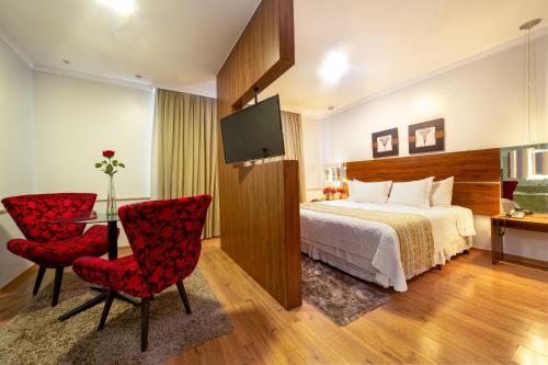 Hotel Porto Madeira tesisinde bir odada yatak veya yataklar