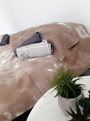 a sculpture of a man with a towel on a couch at Inspired by A.C. in Šibenik