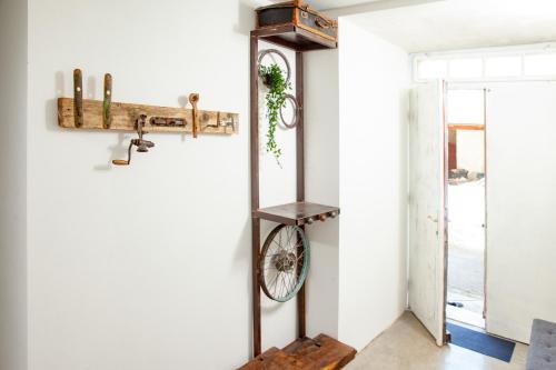 a room with a bike hanging on the wall at Hiška pod Krasom in Renče