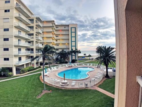 an outdoor swimming pool in front of a building at Siesta Key Beach 5830 #T34 in Siesta Key