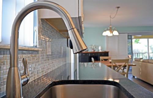 a kitchen sink with a faucet in a kitchen at Crescent Beach 1011 #3 in Sarasota