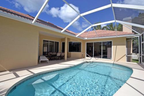 a swimming pool in the backyard of a house at Siesta Key Beach - Cape Aqua 5545 in Siesta Key