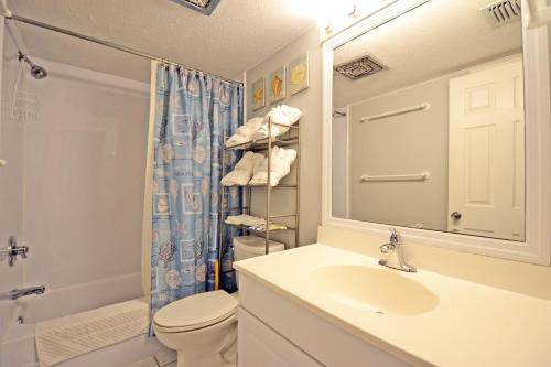a bathroom with a sink and a toilet and a shower at Sea Club II 5955 #8E in Siesta Key
