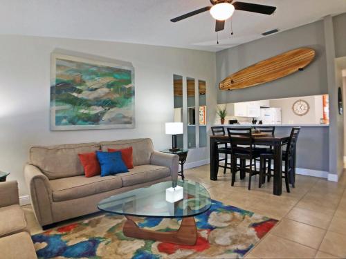 a living room with a couch and a table at Holmes Beach - Mangroves 3607 #208 in Holmes Beach