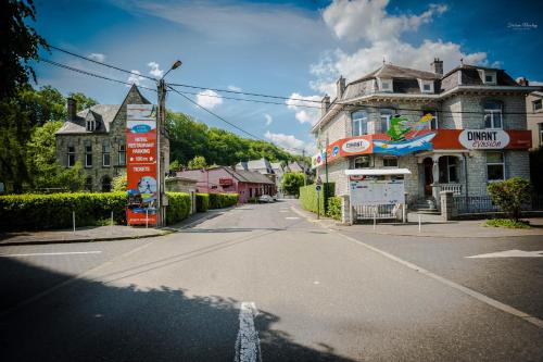 an empty street in front of a house at Voisins du kayak in Dinant