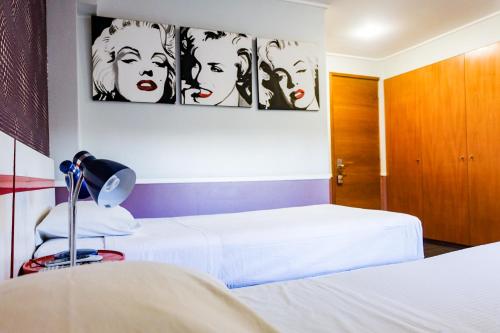 Ένα ή περισσότερα κρεβάτια σε δωμάτιο στο GUANAKO Hostel