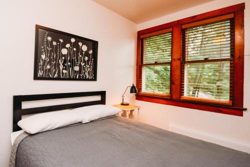 a bedroom with a bed and a window at Rainbow Mountain Resort - LGBTQ Friendly in East Stroudsburg
