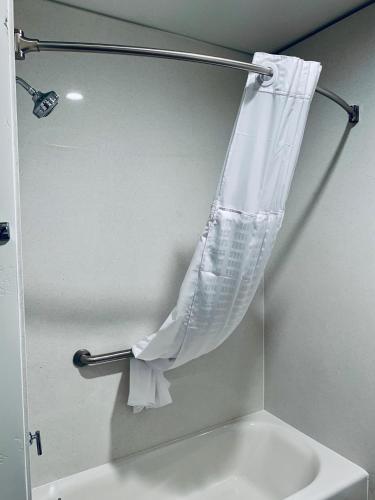 a shower curtain hanging over a sink in a bathroom at Zion Canyon Lodge in Springdale