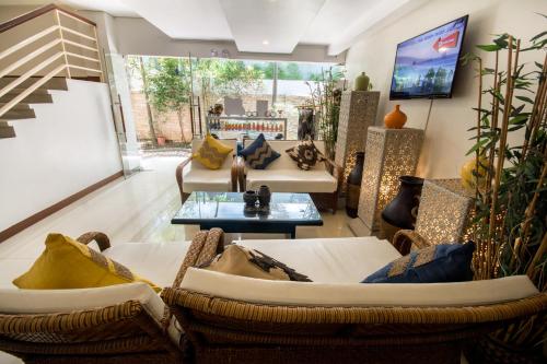 a living room with two couches and a table at Sur Beach Resort Boracay in Boracay