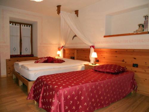 Postel nebo postele na pokoji v ubytování Hotel Garnì Salvanel