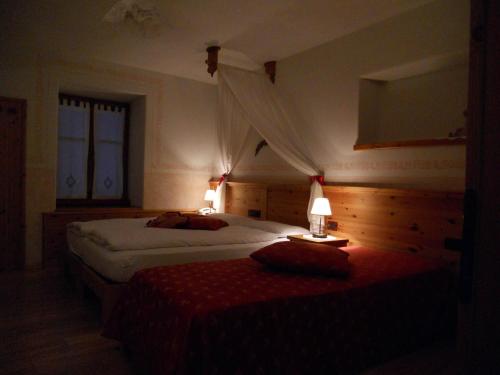 Postel nebo postele na pokoji v ubytování Hotel Garnì Salvanel