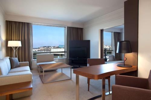 a living room with a couch and a table at Hyatt Regency Belgrade in Belgrade