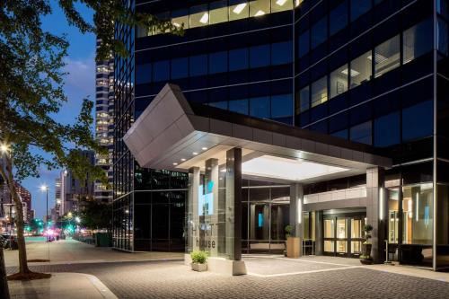 a building in a city at night at Hyatt House New Orleans Downtown in New Orleans