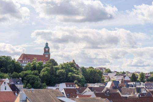 a view of a city with a clock tower at Ramada by Wyndham Flensburg City in Flensburg