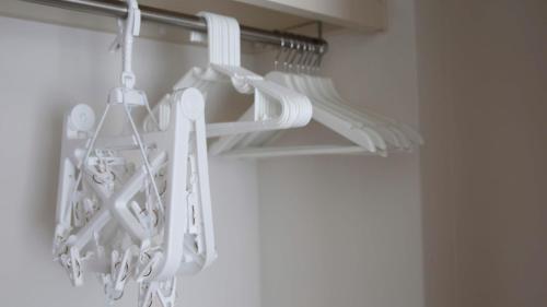 a bunch of white dishes are hanging in a closet at beautiful Mt.Fuji A in Fujikawaguchiko