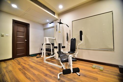a room with a gym with chairs and a chalkboard at Vivanta Katra Vaishno Devi in Katra