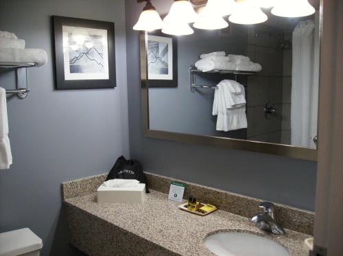 a bathroom with a sink and a mirror at Best Western Plus Bradford Inn in Bradford
