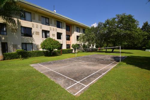 a tennis court in front of a building at Vivanta Katra Vaishno Devi in Katra