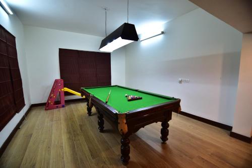 a room with a pool table and a slide at Vivanta Katra Vaishno Devi in Katra