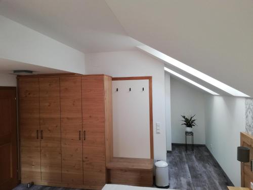 an attic room with a closet and a door at Haslgut in Fuschl am See