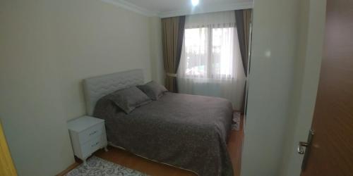 Ліжко або ліжка в номері New Family Apartment