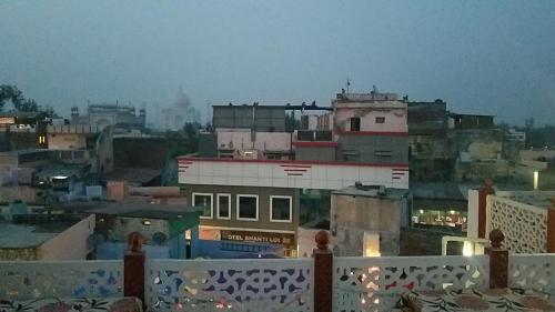 a view of a city at night with buildings at Sai Palace in Agra