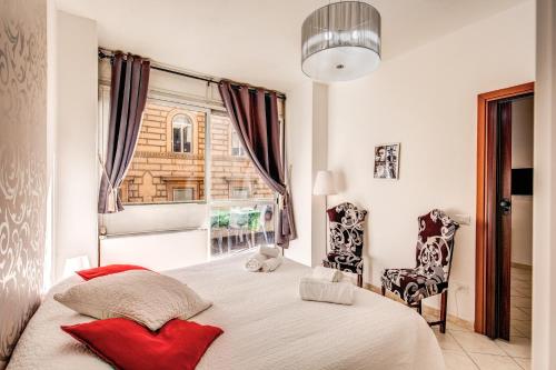 Postel nebo postele na pokoji v ubytování M&L Apartments - Ardesia Colosseo