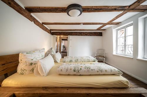a bedroom with a large bed with pillows at Ferienwohnungen Finkenherd 5 in Quedlinburg