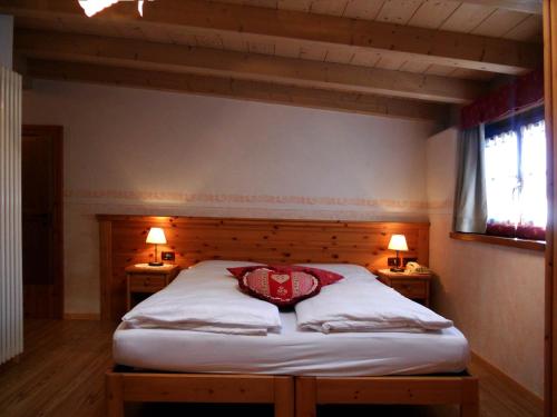 Postel nebo postele na pokoji v ubytování Hotel Garnì Salvanel