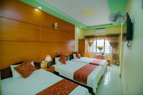 Cat Ba Bay Vision Hotelにあるベッド