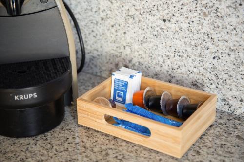 a wooden box with a bunch of tools on a counter at Sky Touristic Attic in Valencia