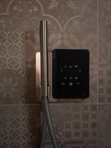 a electrical outlet on a wall in a bathroom at Chalet Stella Alpina in Val di Zoldo